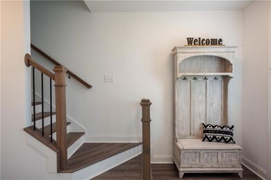 Mudroom featuring wood finished floors and baseboards