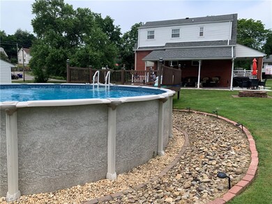 View of swimming pool with a lawn