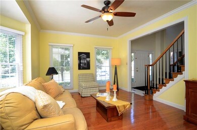 The living room offers beautiful hardwood floors a