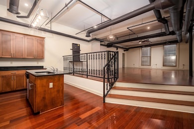 Garage with a sink and baseboards
