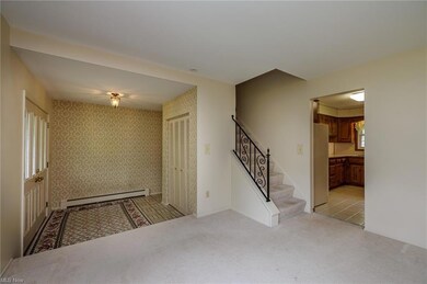 Spacious foyer entry with guest closet