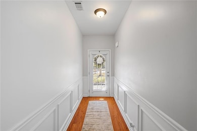 Doorway to outside with light wood-type flooring, 