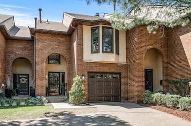 Front of home shows entry, garage, and primary bedroom bay window perfect for a reading nook