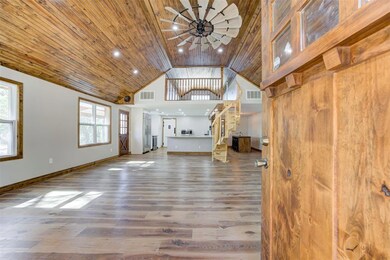 Unfurnished living room with wood finished floors,