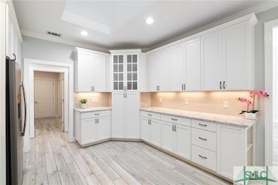 Kitchen w/Stainless Steel Appliances, White Shaker