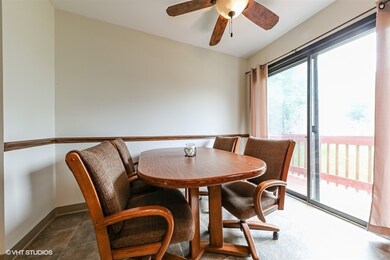 Eating area with ceiling fan and sliding glass doo