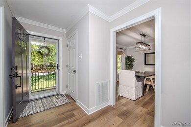 Entrance foyer featuring an inviting chandelier, h