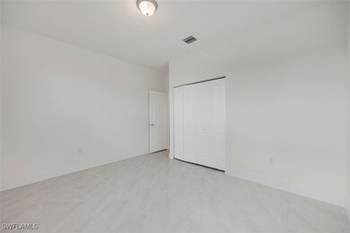 Unfurnished bedroom with a closet, visible vents,
