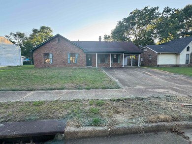 Single story home featuring a carport and a front 