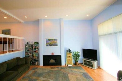 Smooth ceilings, laminate wood flooring, recessed 