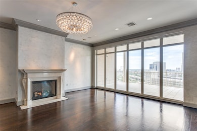 Unfurnished living room with crown molding, a nota