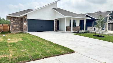 View of front facade featuring an attached garage