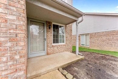 Entrance to property with brick siding