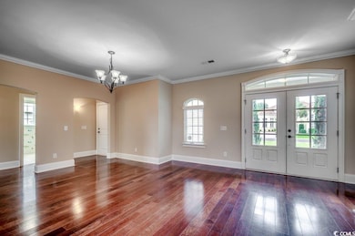 Interior space with crown molding, french doors, h