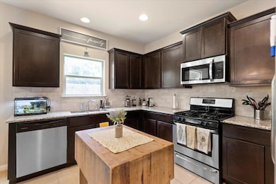 Kitchen featuring appliances with stainless steel