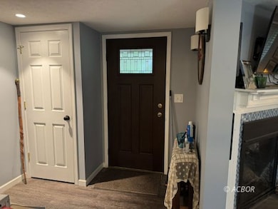 Front door, coat closet