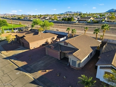 Aerial view of residential area featuring a mountain backdrop