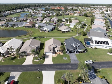 Aerial overview of property's location with a large body of water and nearby suburban area