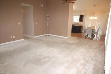OPEN TO THE KITCHEN / HALL LEADS TO THE BEDROOMS A