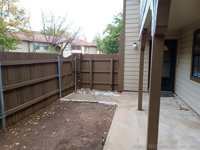 Enclosed patio with privacy fence.