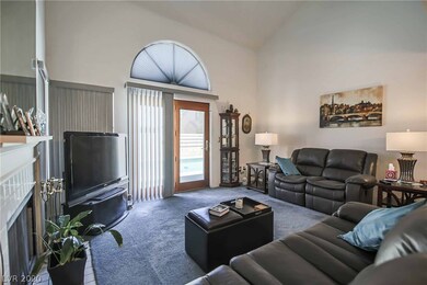 Living room features 16' vaulted ceiliing, firepla