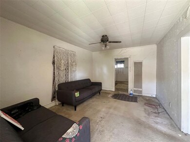 Living room featuring ceiling fan