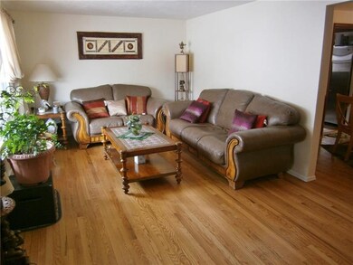LIVINGROOM WITH REFINISHED HARDWOOD FLOORS