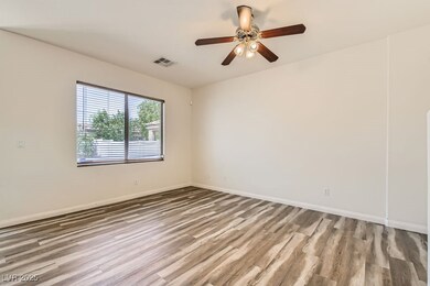 Open great room featuring luxury vinyl floors, bas