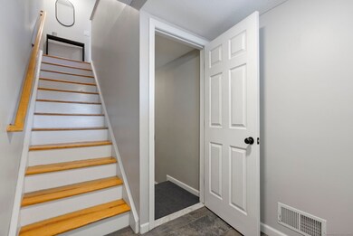 Foyer, lower stairs to office area