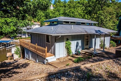 Wrap around deck provides access to the lakeside and road side of the house.