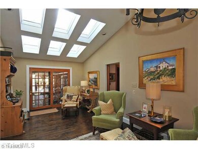 Keeping Room. Keeping Room with skylights with French doors leading to covered porch.