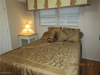 Bedroom with wood-type flooring