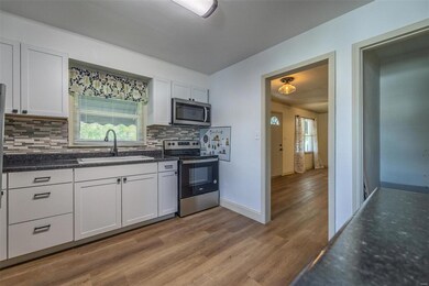 New Kitchen with pretty stainless appliances.
