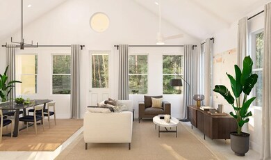 Great room with vaulted ceiling and white painted ceiling beams