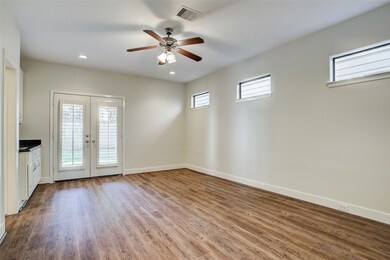 First floor bedroom with a wet bar could be used a
