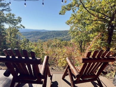 View of mountain background featuring a heavily wooded area
