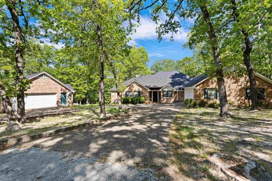 Single story home featuring driveway and brick sid