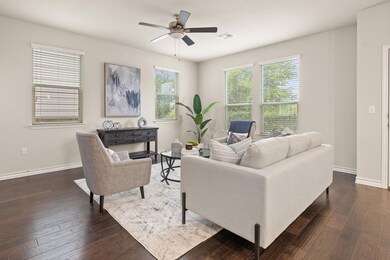 Living room with wood-type flooring, visible vent