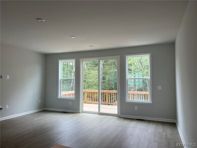 Empty room with light hardwood floors