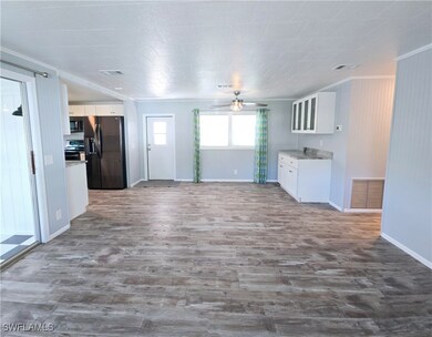 Living room looking towards dining room and side d