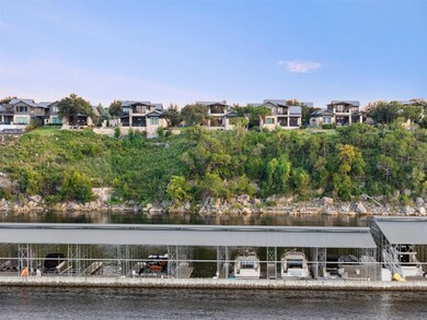 Aerial perspective of suburban area featuring a large body of water
