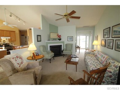 Living room with gas fireplace with fan blower