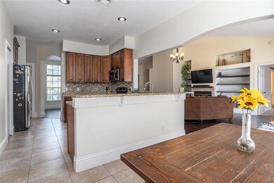 Breakfast nook and kitchen are open to the family room