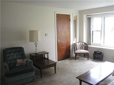 Living Room LR has door to front entrance + stairs