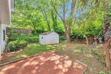 Fenced backyard featuring a patio