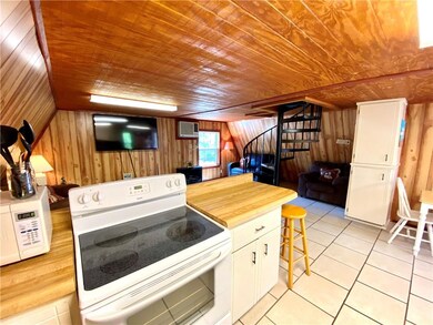 Kitchen overlooks living room.