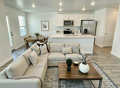 Living area featuring light wood-style floors and recessed lighting