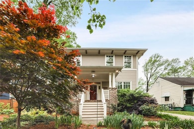 Front of home with Maple tree and beautiful landsc