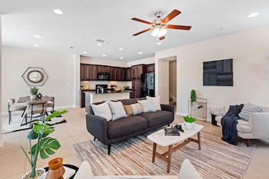 Bright and open floor plan with seamless flow between the living, dining, and kitchen areas, all accented by durable tile flooring for a clean, modern look and easy maintenance ~