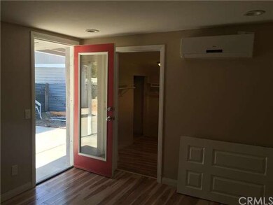 Master bedroom that leads to the backyard.  Walk i